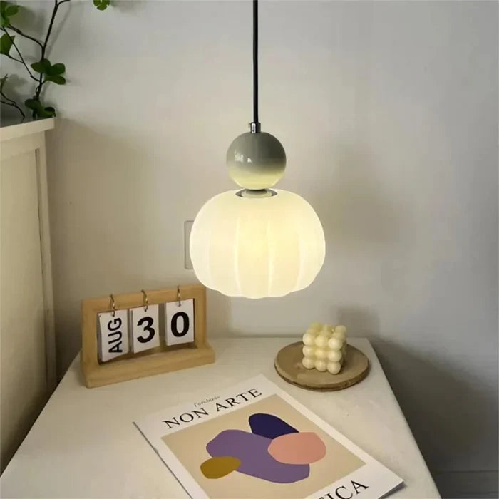 Art Deco pendant lamp — cream shade with a colorful spherical accent