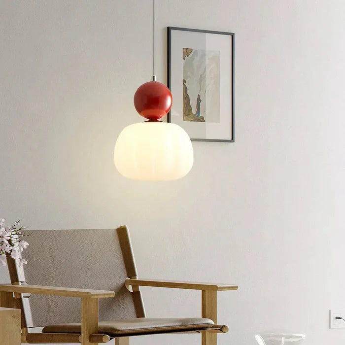 Art Deco pendant lamp — cream shade with a colorful spherical accent