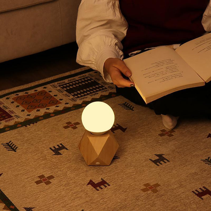 Lampka nocna z dotykowym sterowaniem, ładowaniem USB i nowoczesnym designem, featuring geometryczną podstawę LED 4