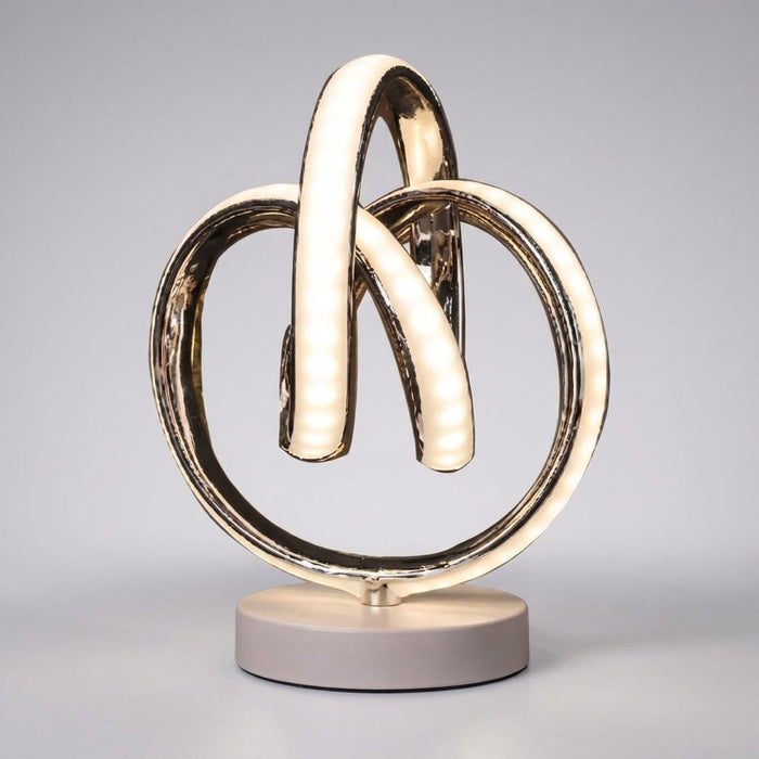 Zakrzywiona lampa stołowa LED z kompaktową podstawą, nowoczesny design, ciepłe światło, ideal 0