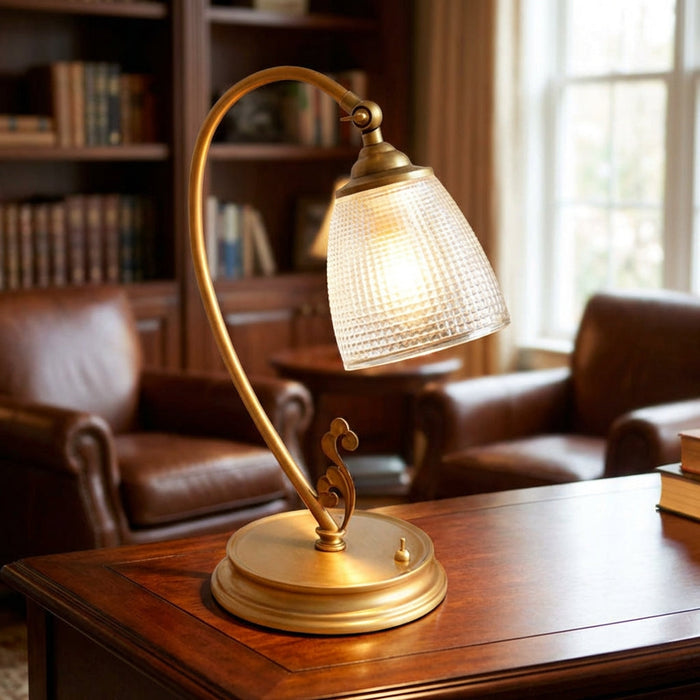 Lampa stołowa vintage z zakrzywionym designem i metalicznym wykończeniem w kolorze złota, ideal 0