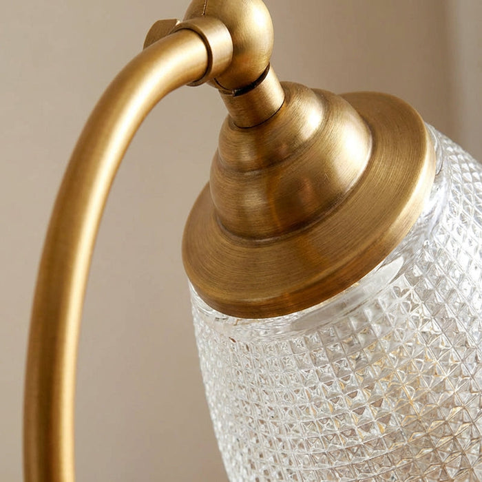 Lampa stołowa vintage z zakrzywionym designem i metalicznym wykończeniem w kolorze złota, ideal 2